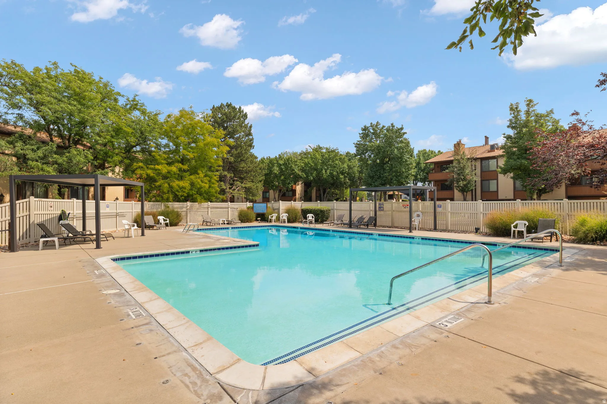Community pool featuring a patio area