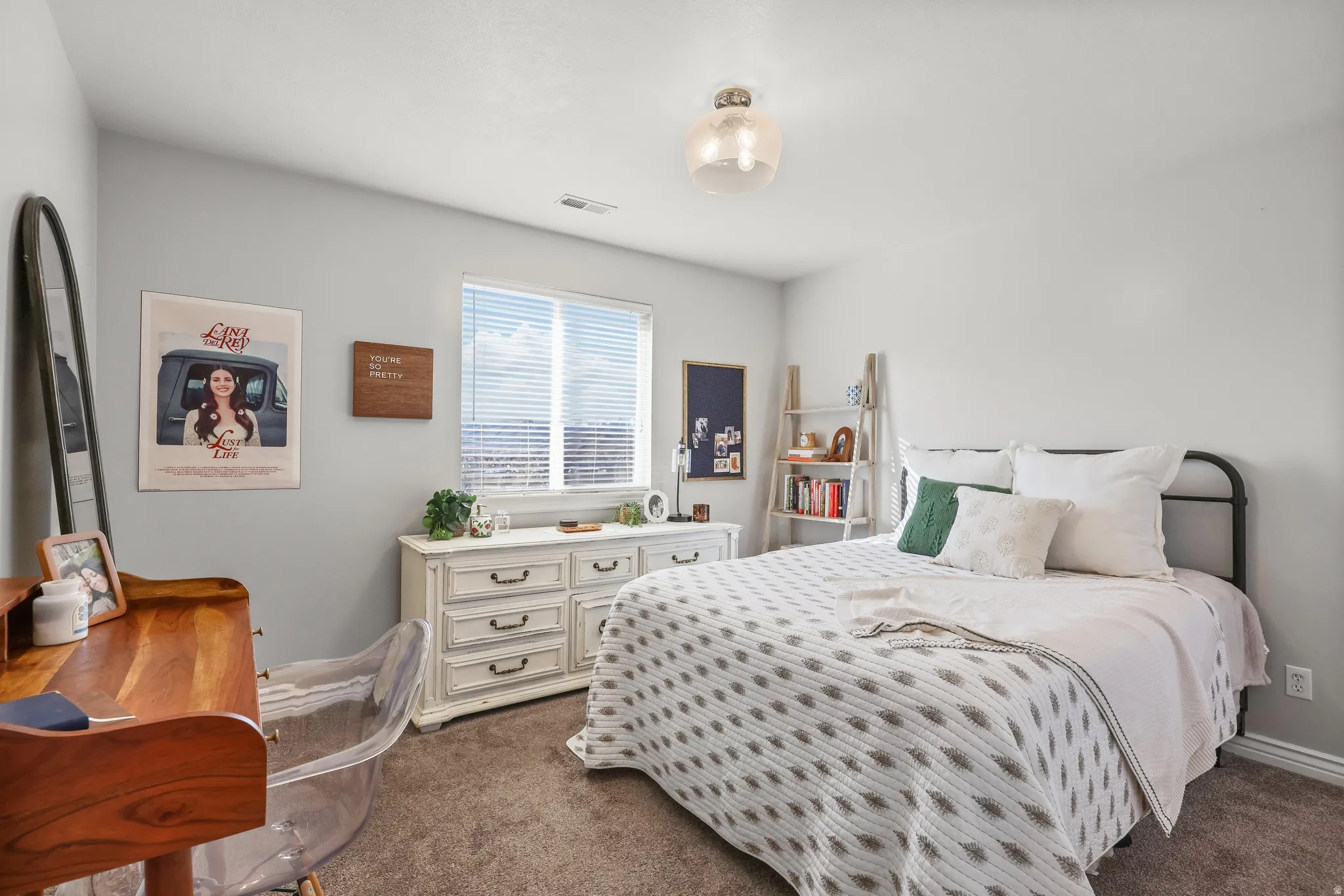 Bedroom with dark colored carpet