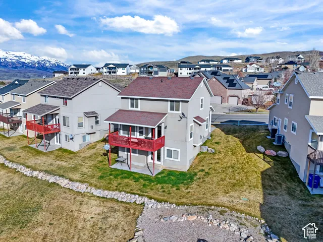 Aerial perspective of suburban area with a mountainous background