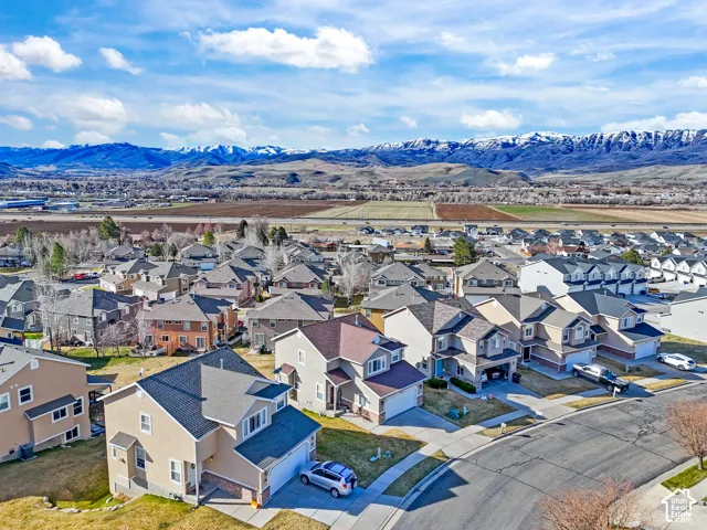 Aerial perspective of suburban area with a mountainous background