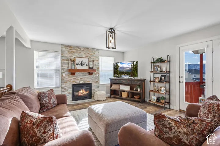 Living area featuring wood finished floors and a fireplace