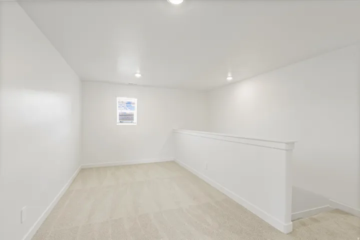 *DISCLAIMER* Interior package and colors may vary.  Below grade area featuring light carpet and recessed lighting