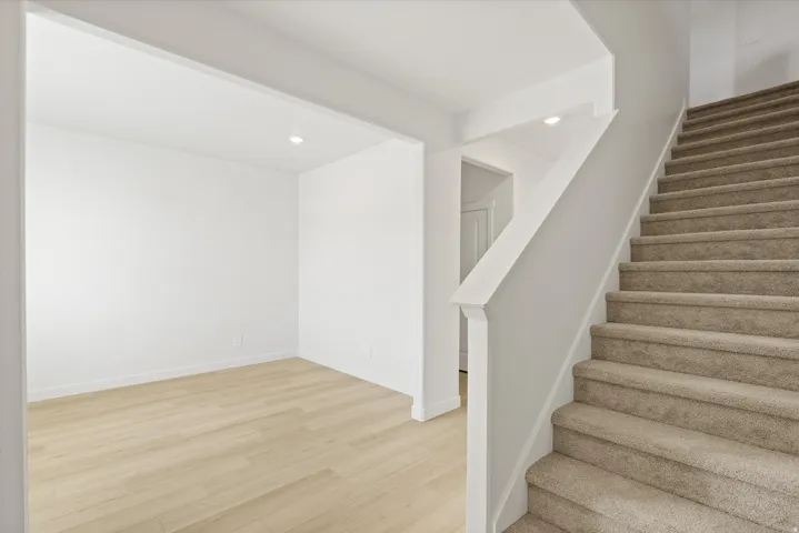 *DISCLAIMER* Interior package and colors may vary.  Stairs featuring recessed lighting and wood finished floors