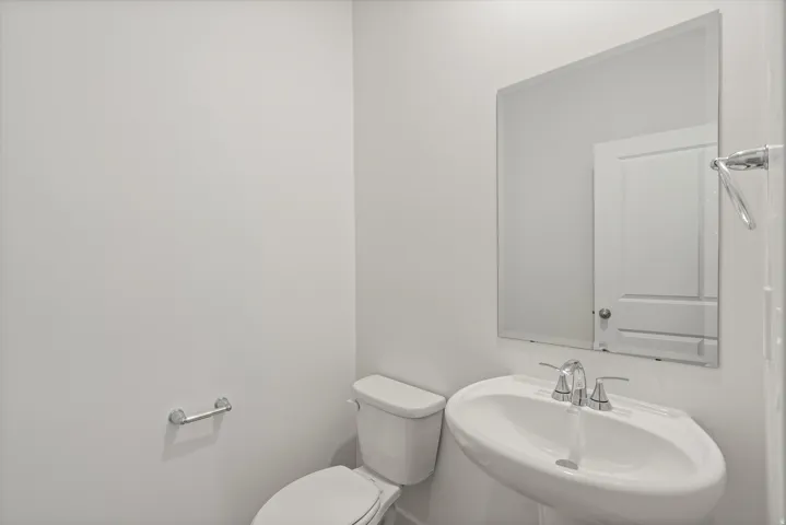 *DISCLAIMER* Interior package and colors may vary.  Bathroom with toilet and a sink
