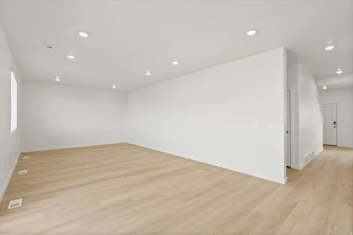 *DISCLAIMER* Interior package and colors may vary.  Unfurnished room featuring light wood-style floors and recessed lighting