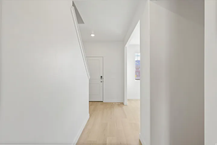 *DISCLAIMER* Interior package and colors may vary. Hallway featuring light wood-style flooring and recessed lighting