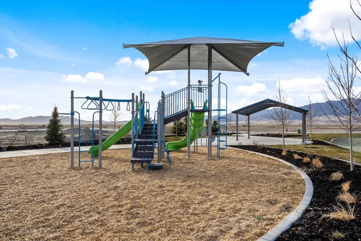 Communal playground featuring a mountain view