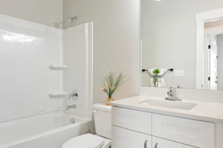 Bathroom with vanity and shower / washtub combination