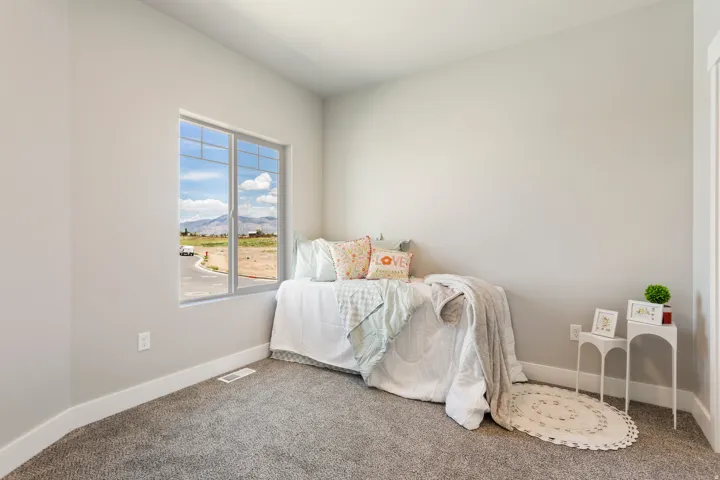 Bedroom featuring a mountain view and carpet floors