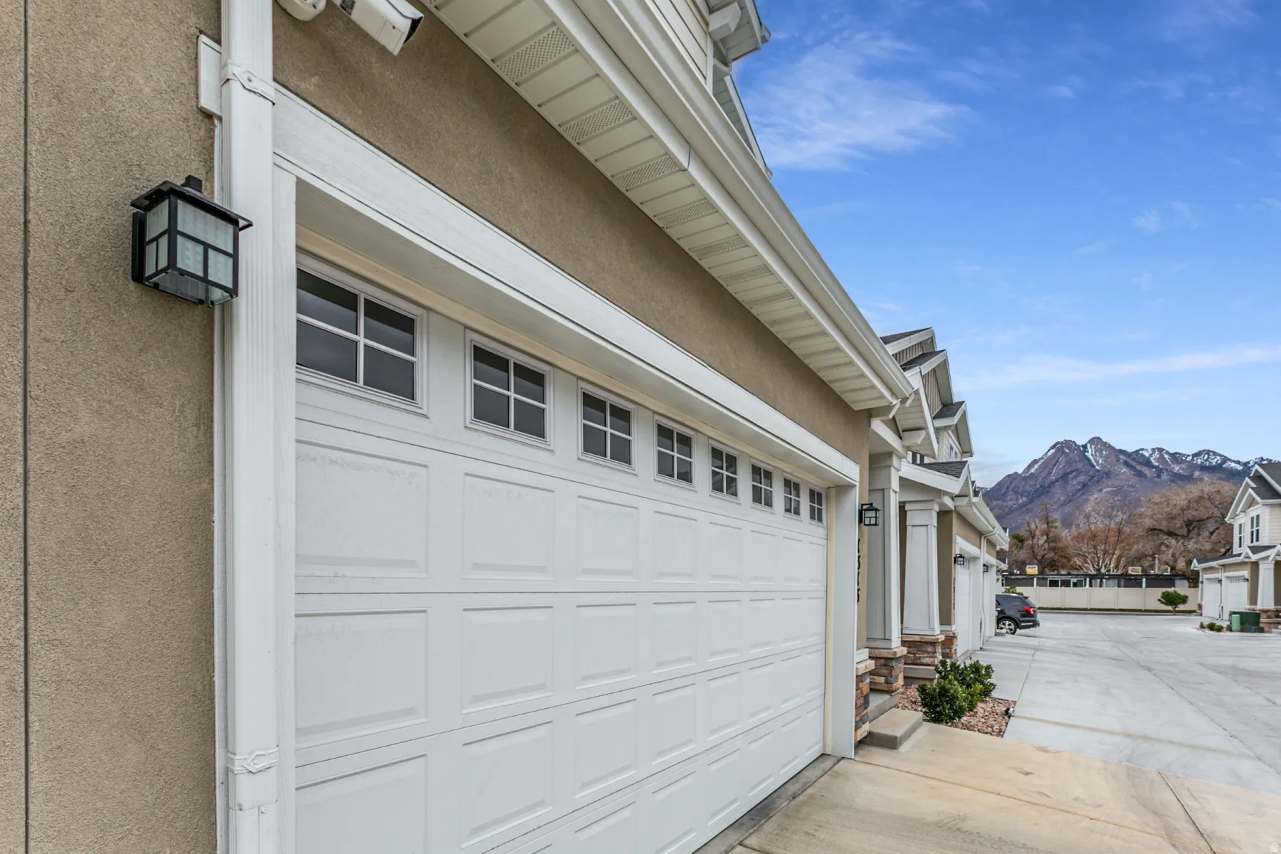 Garage with a mountain view and driveway
