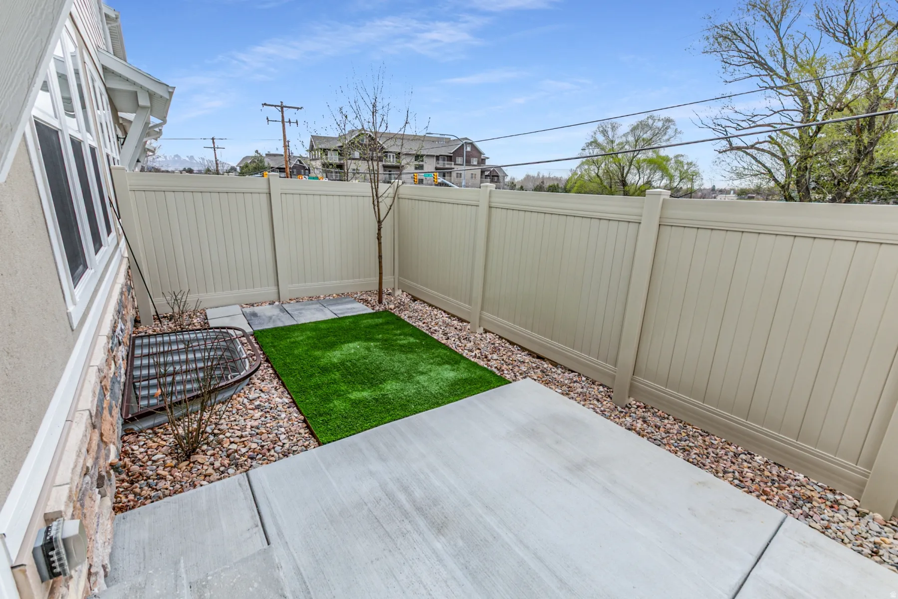 Fenced backyard featuring a patio