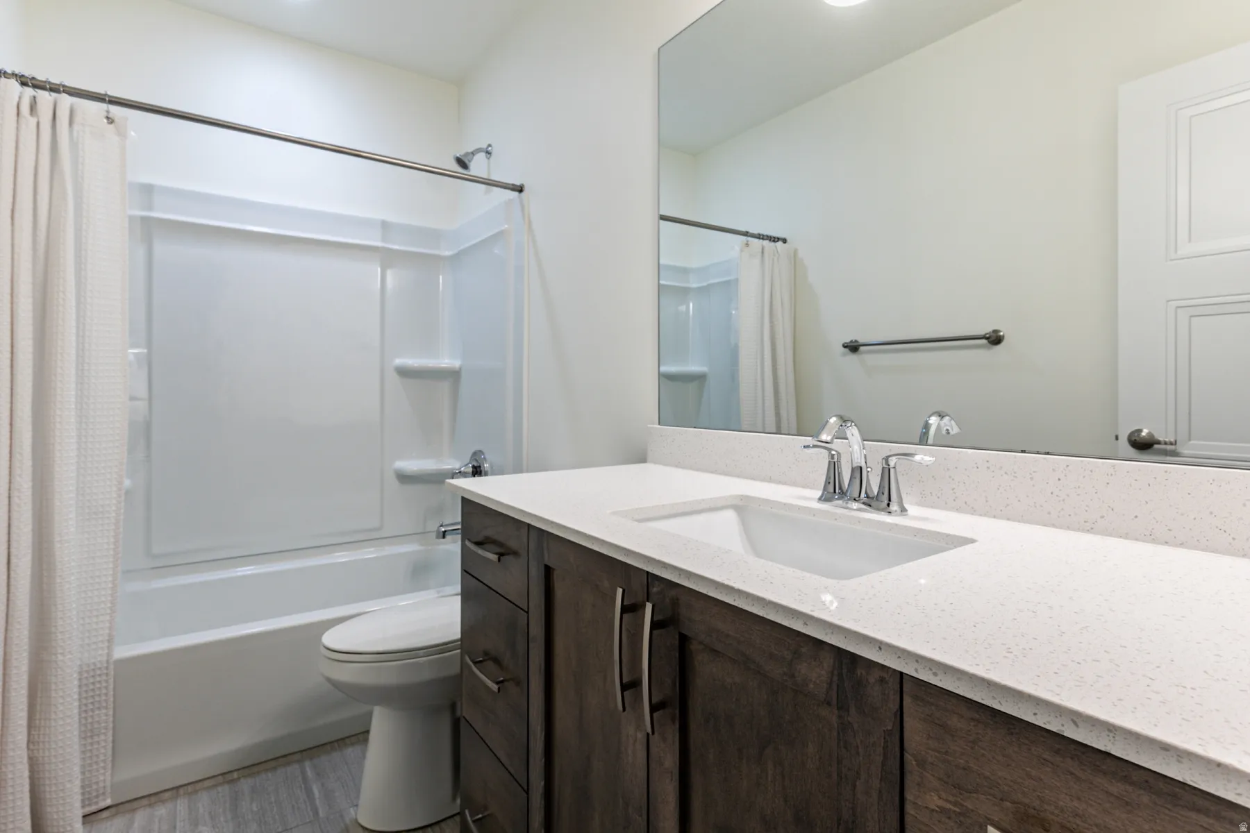 Bathroom with vanity and shower / bath combo