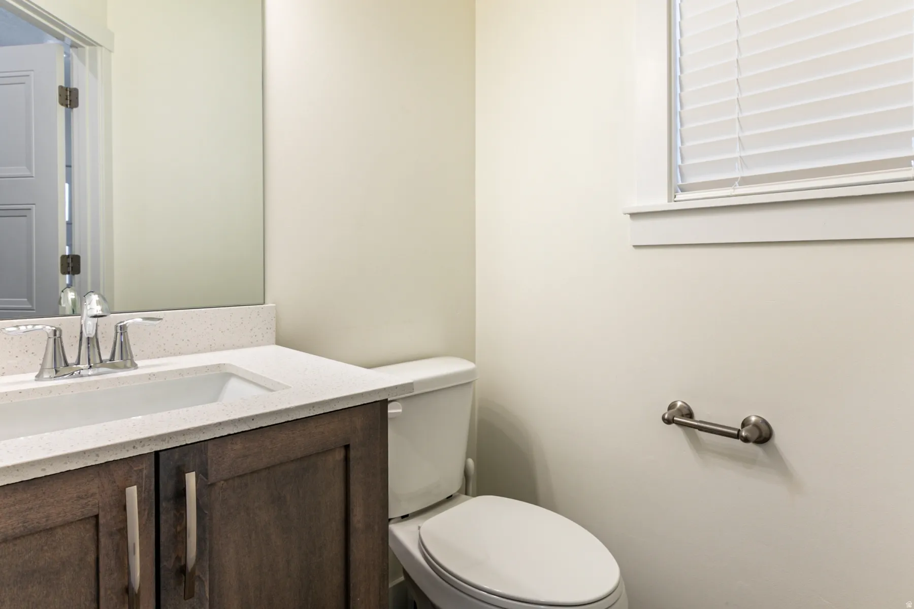 Half bath featuring vanity and toilet