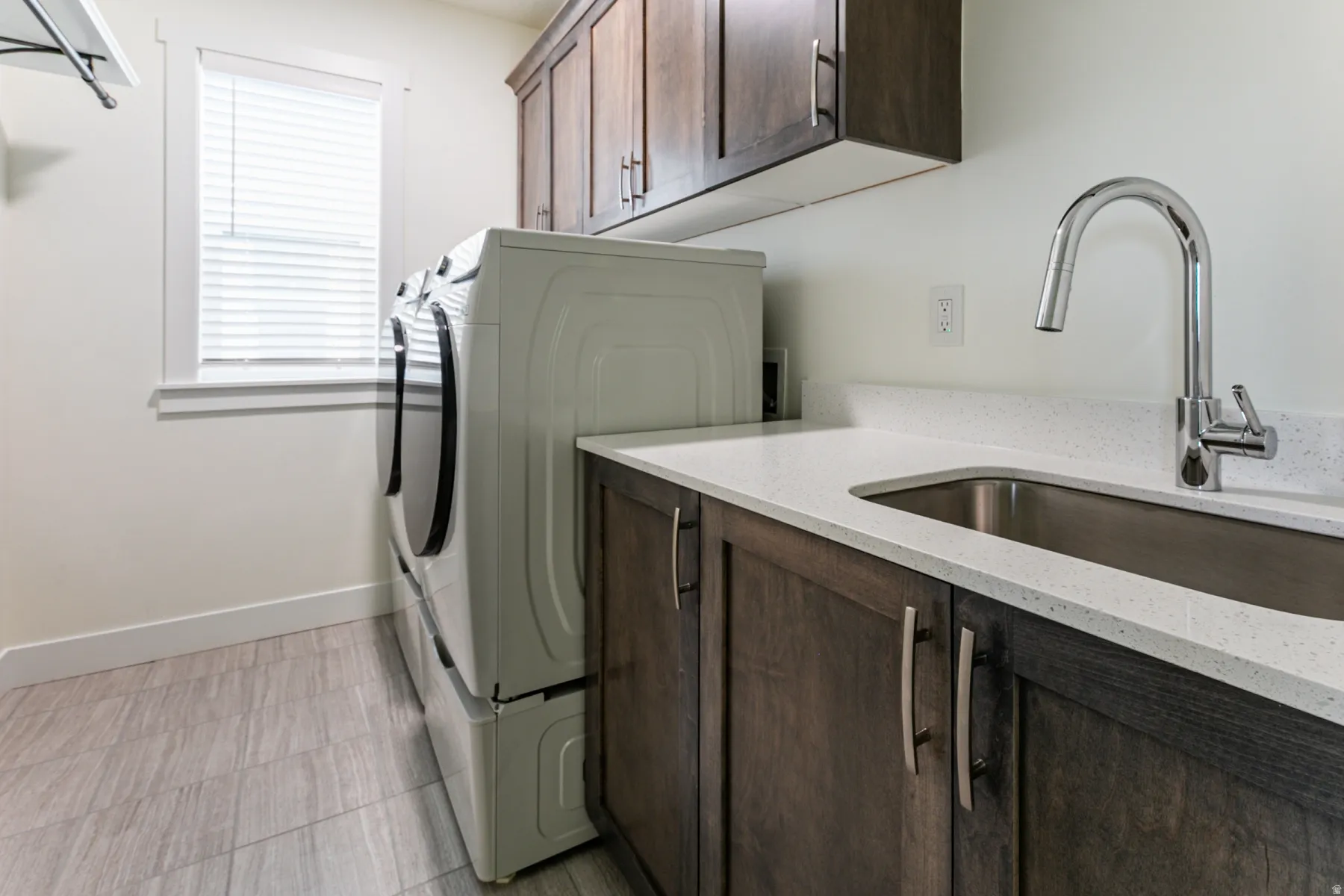 Laundry room with cabinet space and washer and clothes dryer