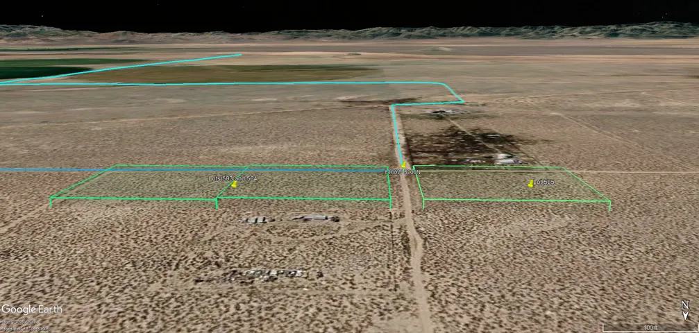 Aerial view of property's location with property parcel outlined and mountains