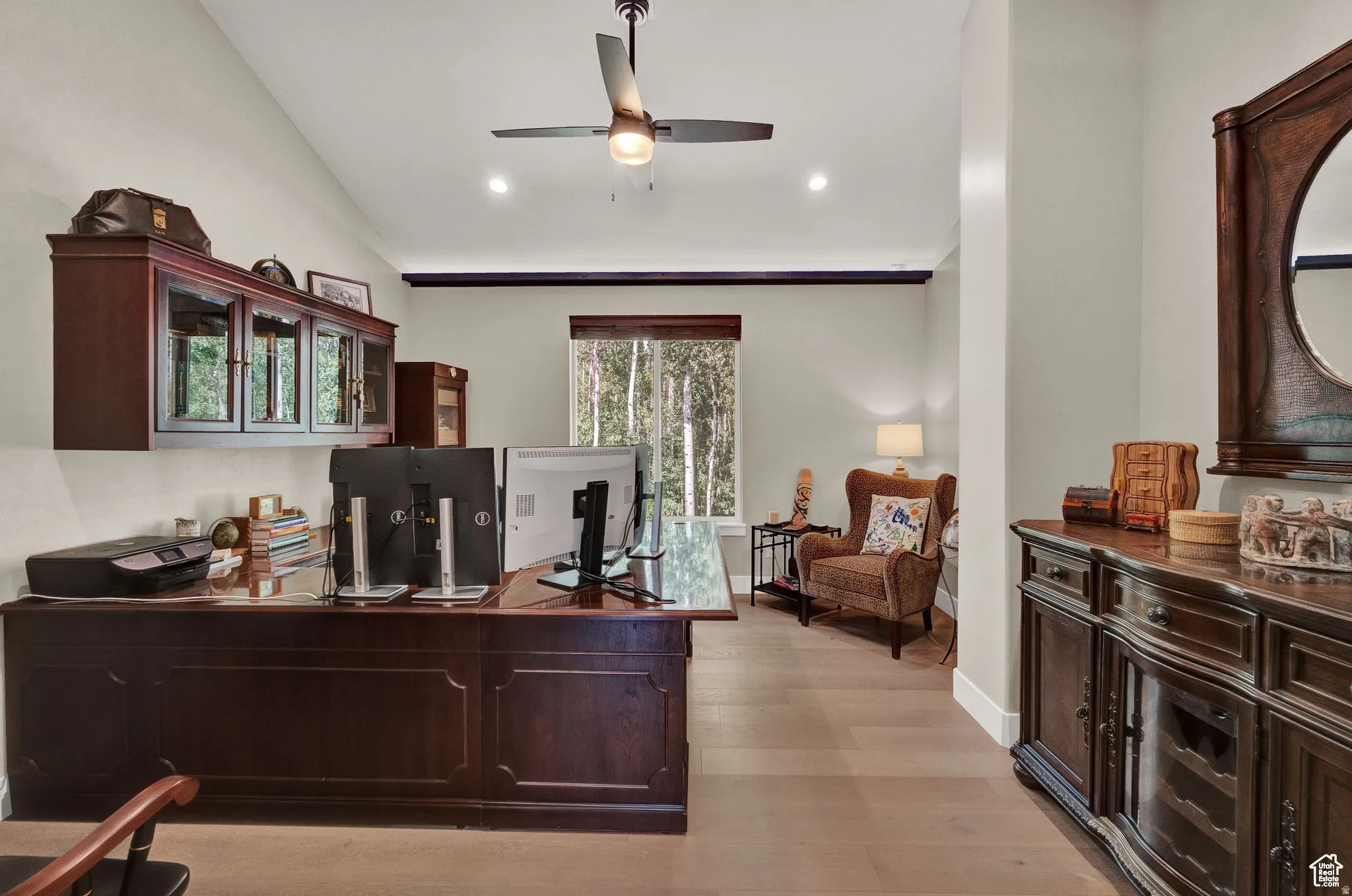 Office with light wood-style floors, lofted ceiling, a ceiling fan, and recessed lighting