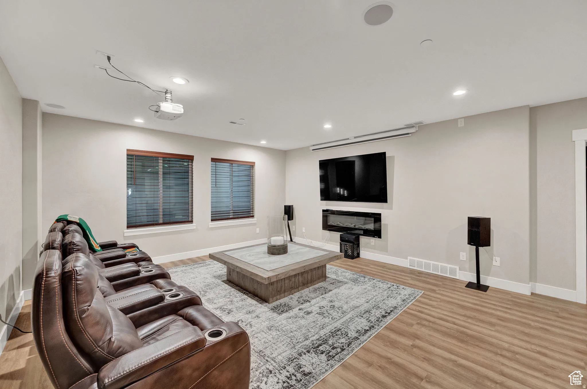Living room featuring light wood-style floors and recessed lighting