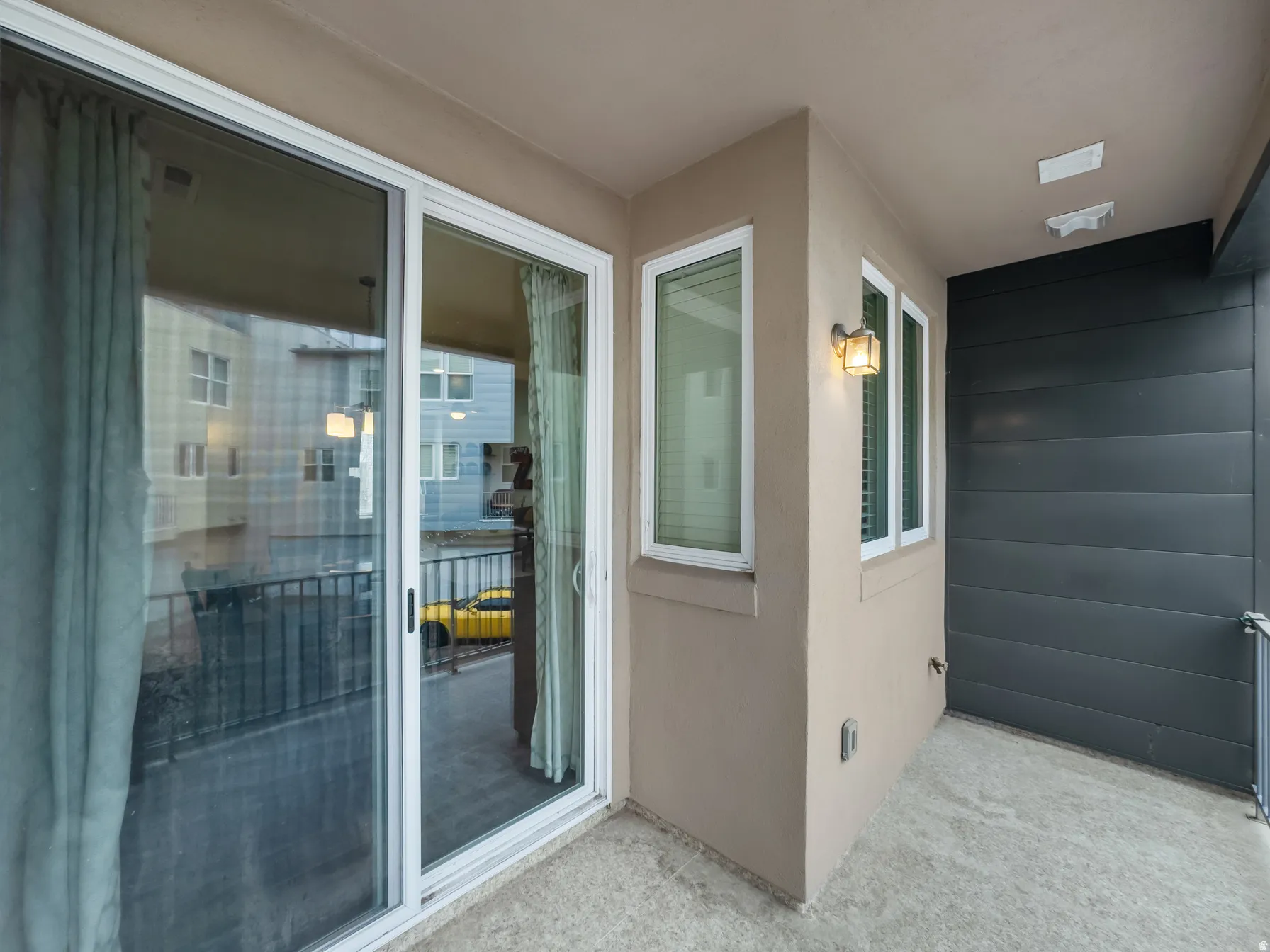 View of exterior entry with stucco siding