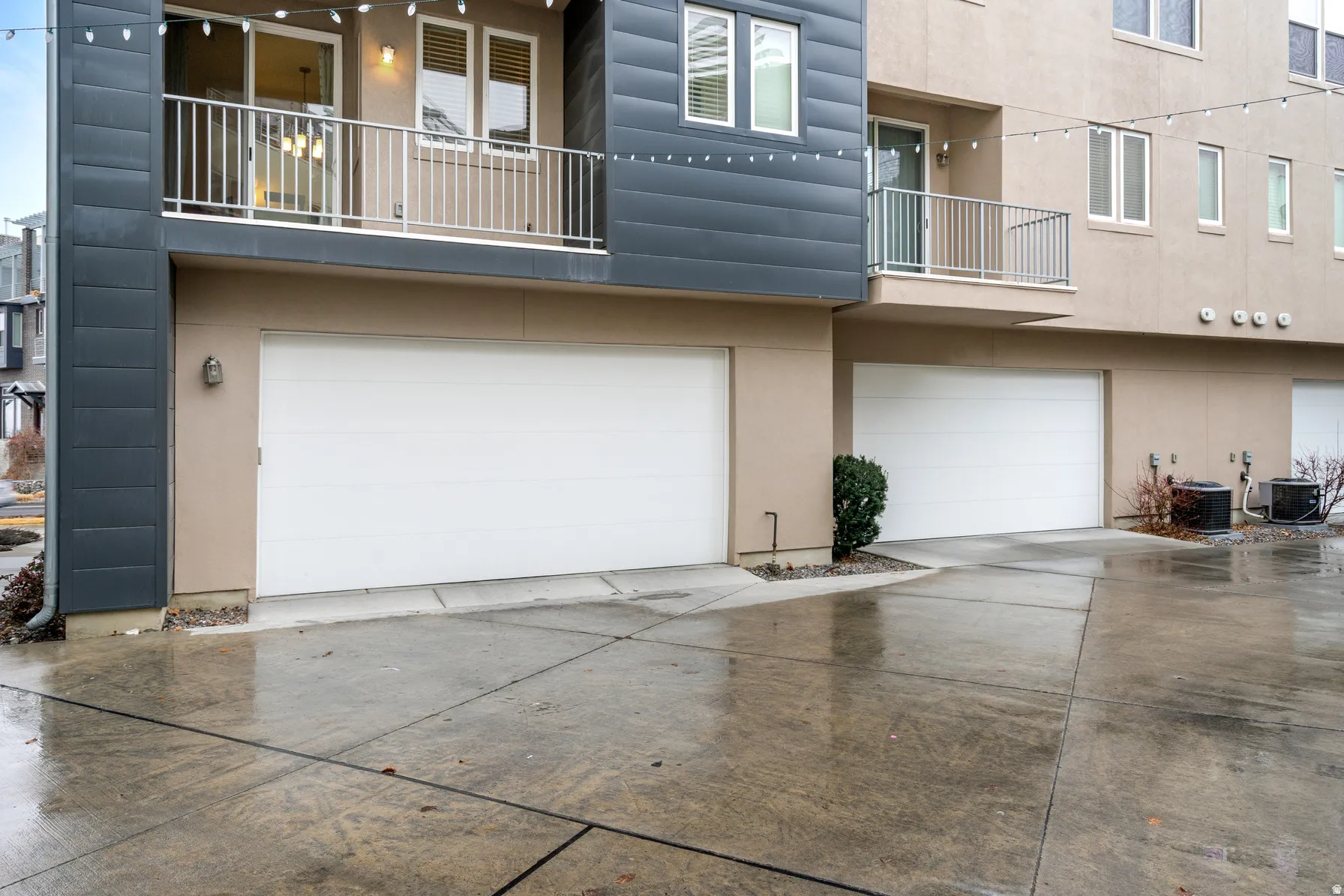 Garage featuring concrete driveway