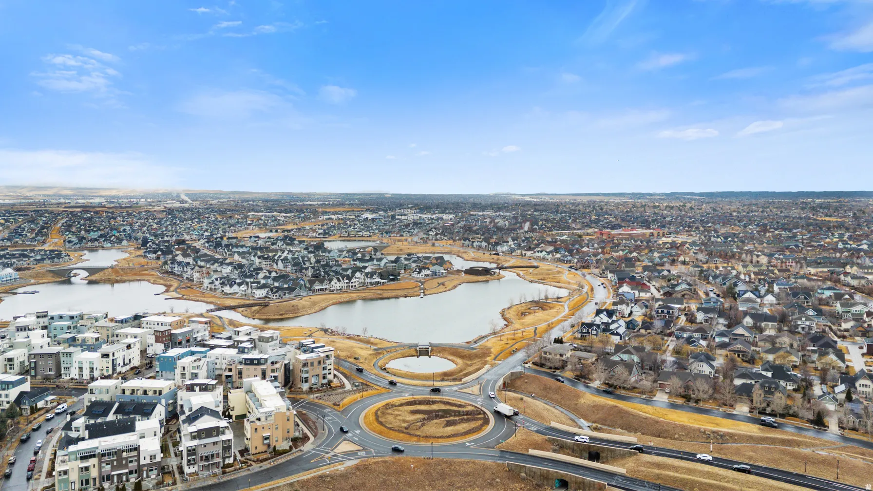 Aerial perspective of suburban area with a large body of water