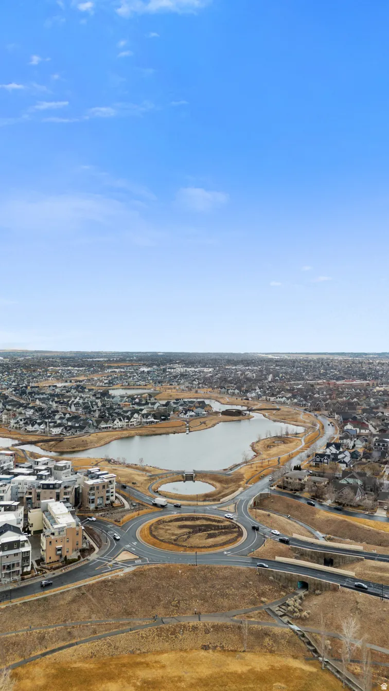 Aerial view of residential area featuring a large body of water