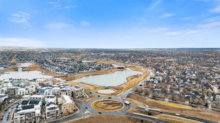 Aerial perspective of suburban area with a large body of water