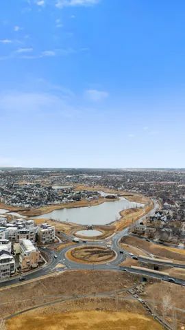 Aerial view of residential area featuring a large body of water