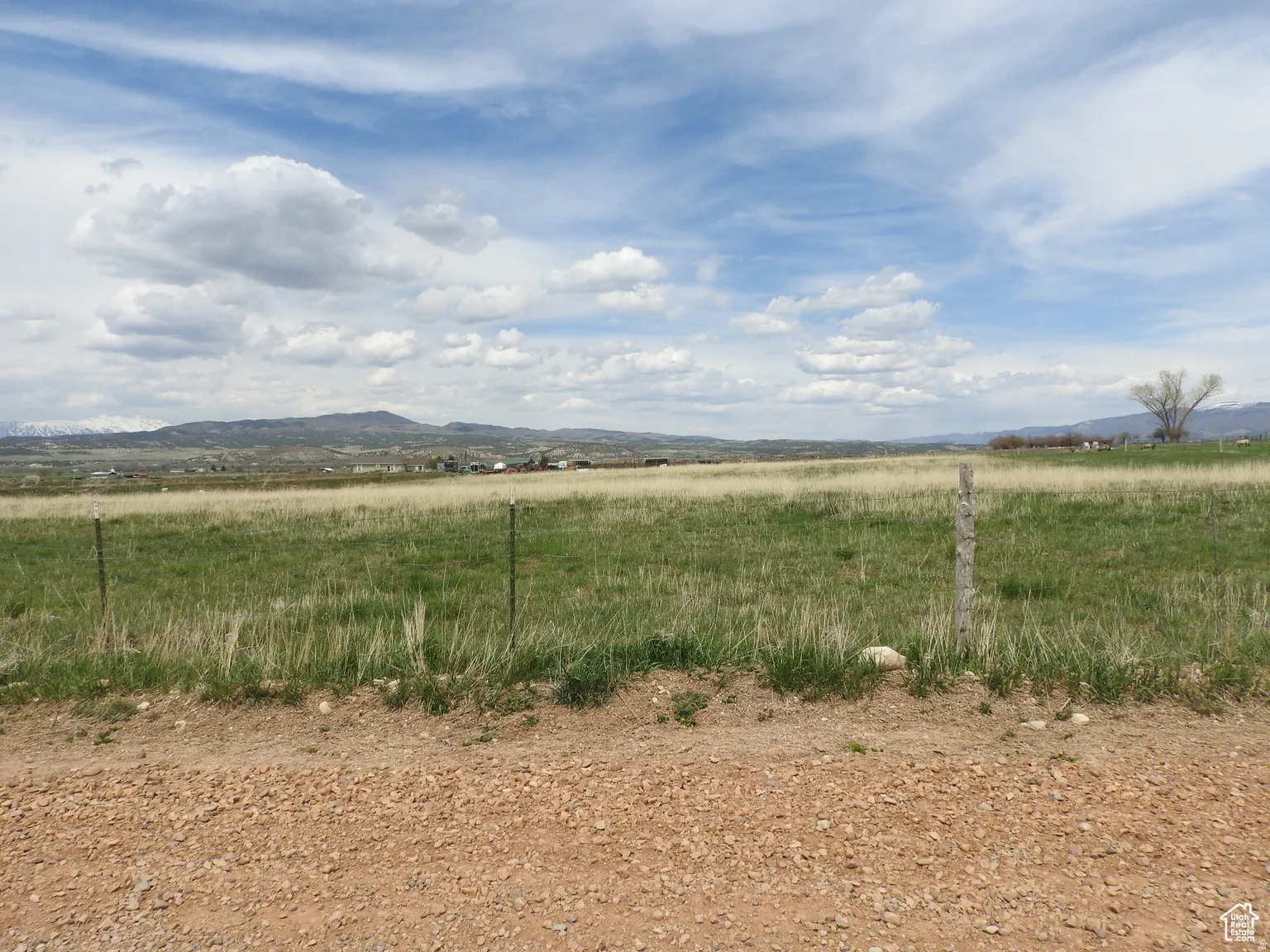 View of mountain backdrop with rural landscape