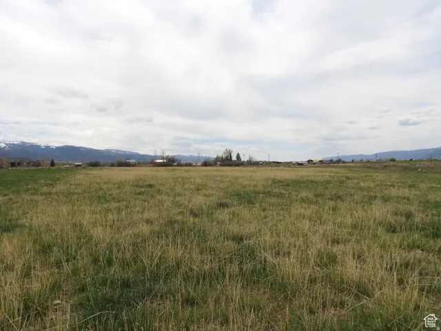 View of nature featuring a mountain backdrop and rural landscape