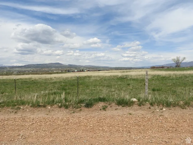 View of mountain backdrop with rural landscape