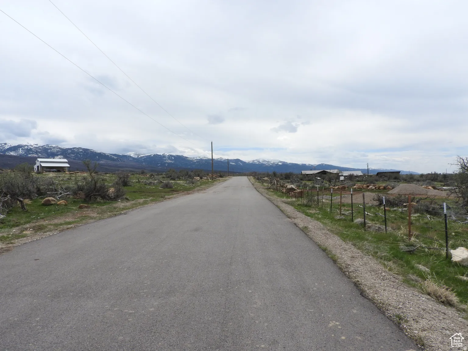 View of asphalt street with a mountain view