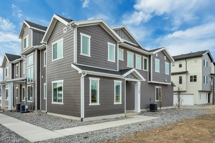 View of front facade featuring board and batten siding and a residential view