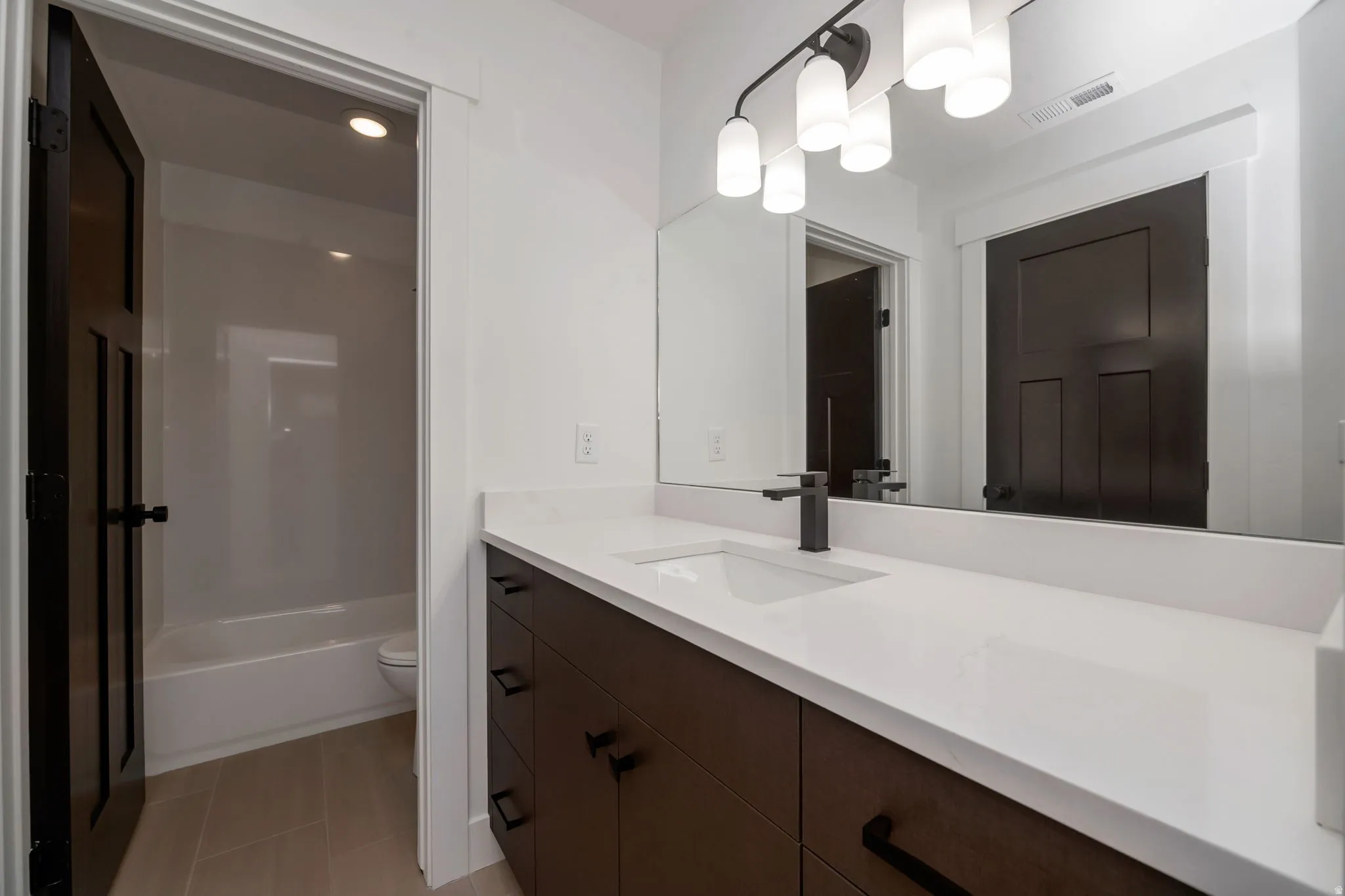 Full bathroom with vanity and shower / bathtub combination