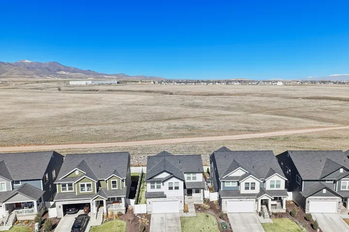 Aerial view of residential area featuring mountains