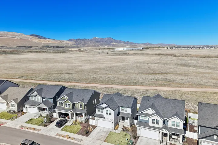 Aerial view of residential area featuring a mountain backdrop
