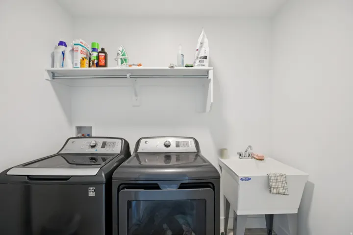 Laundry area with washing machine and clothes dryer