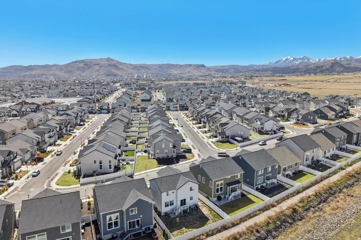 Aerial view of residential area featuring a mountainous background