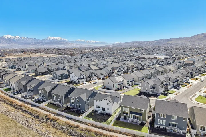Aerial perspective of suburban area with a mountain backdrop