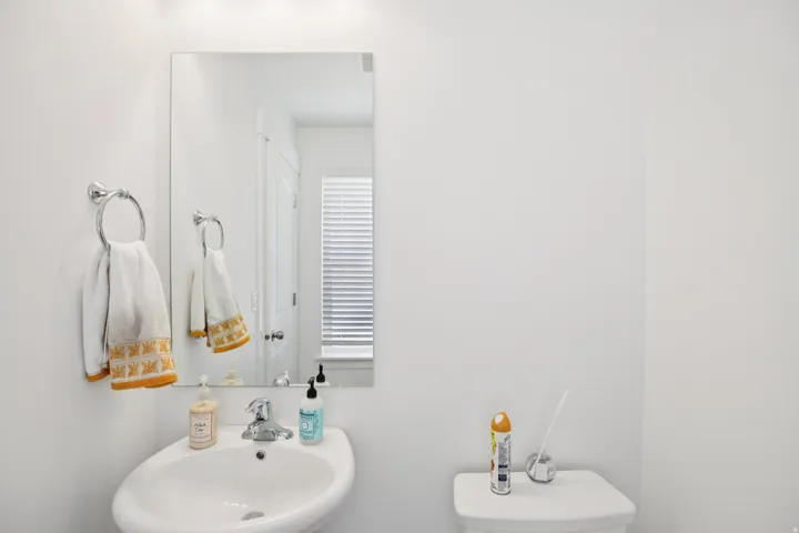 Half bath with a sink and toilet
