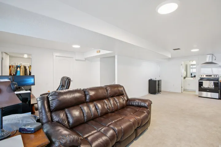 Living room featuring light carpet and recessed lighting