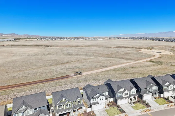 View of rural area with nearby suburban area and a mountainous background