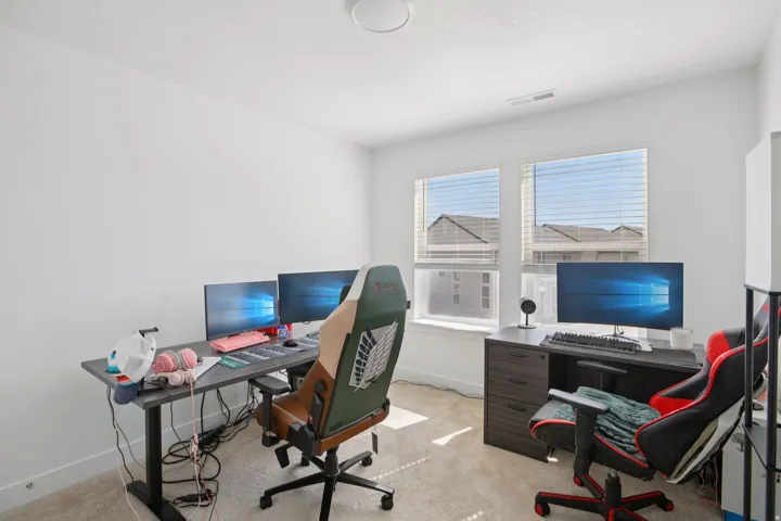 Office area with light carpet and baseboards