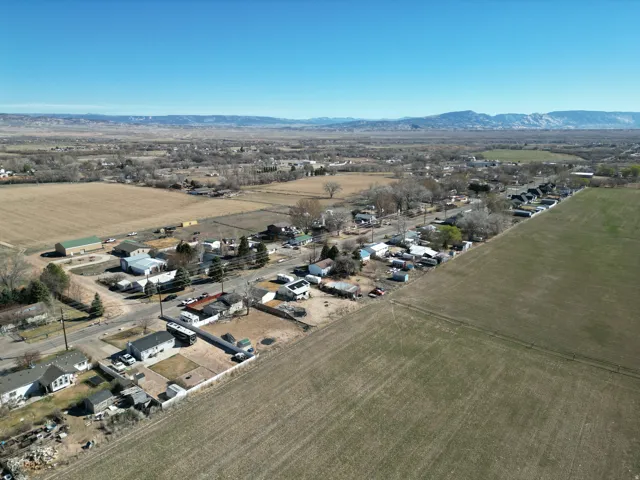 Aerial overview of property's location with rural landscape and nearby suburban area-looking north east.