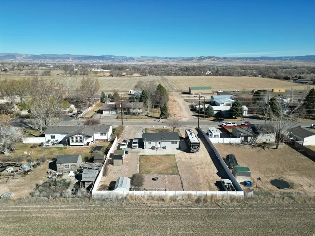 View of rural area featuring nearby suburban area and a mountain backdrop-looking north