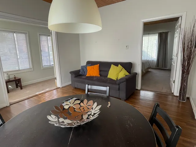 Living area featuring wood finished floors and a vaulted wood ceiling