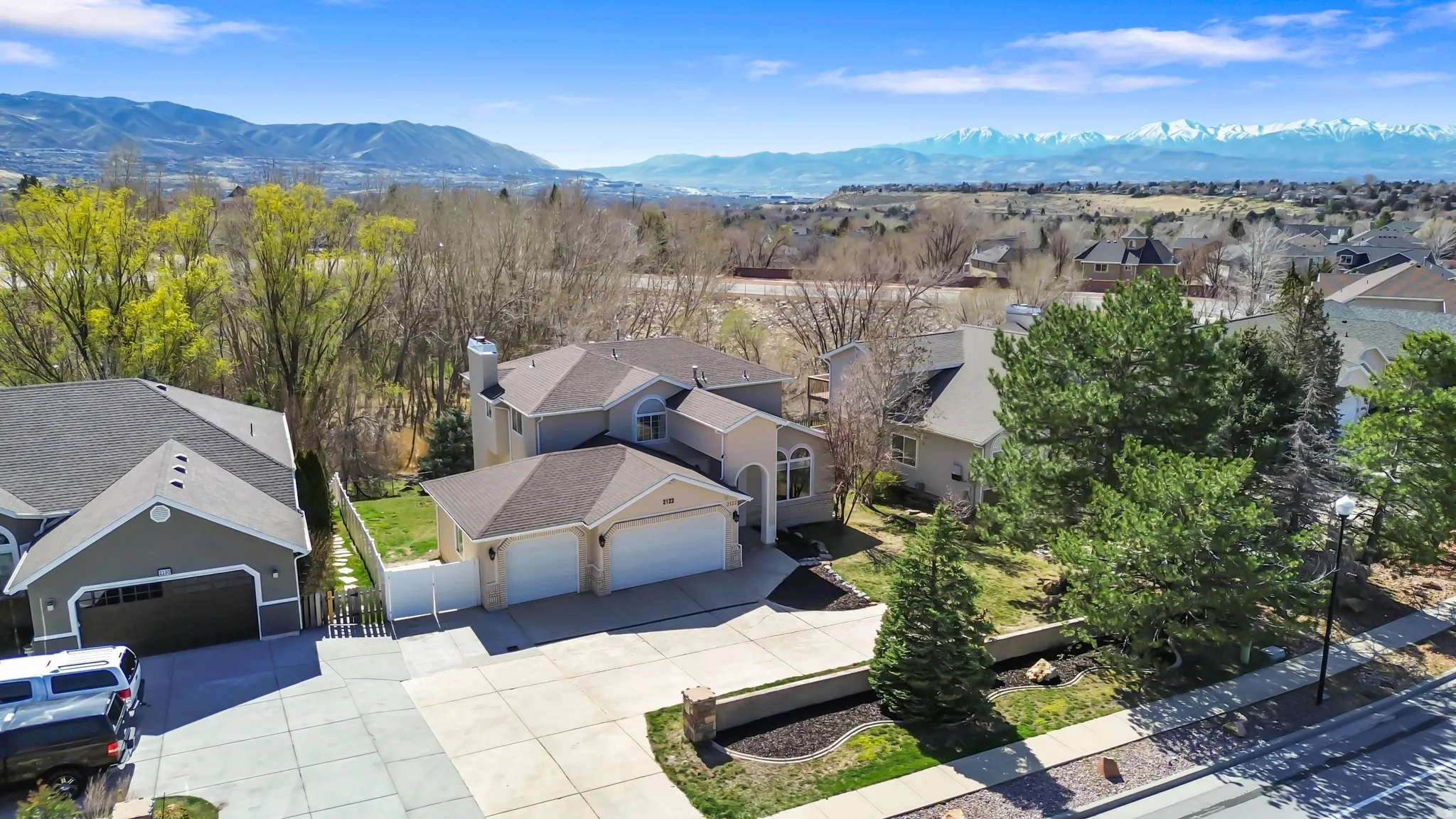 Aerial view of residential area featuring a mountainous background