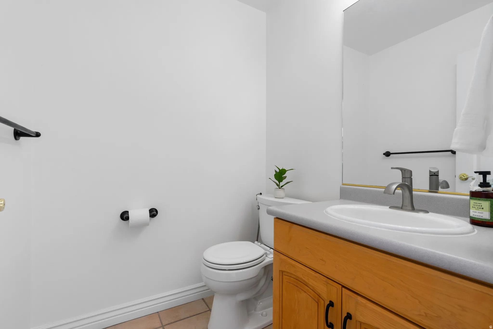 Bathroom with vanity and light tile patterned flooring