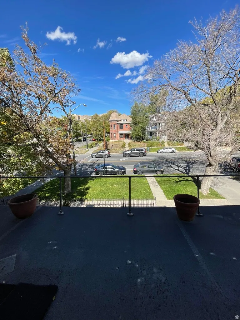 Exterior space with street lights, a residential view, and sidewalks