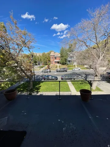 Exterior space with street lights, a residential view, and sidewalks