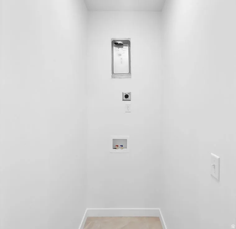 Laundry room with hookup for an electric dryer and hookup for a washing machine